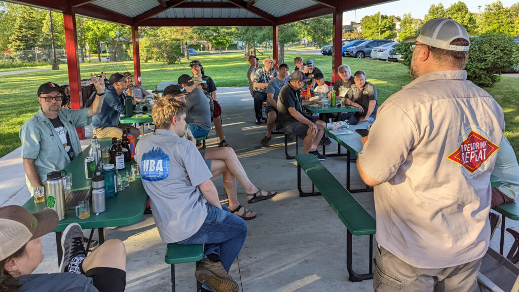 Outdoor June meeting under the pavilion at ESNS on a sunny summer evening